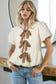 White Textured Bow Bubble Hem Puff Short Sleeve Blouse